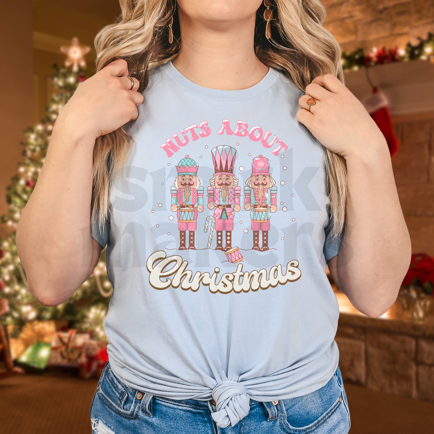 "Nuts about Christmas" funny Christmas nutcracker tee in baby blue.