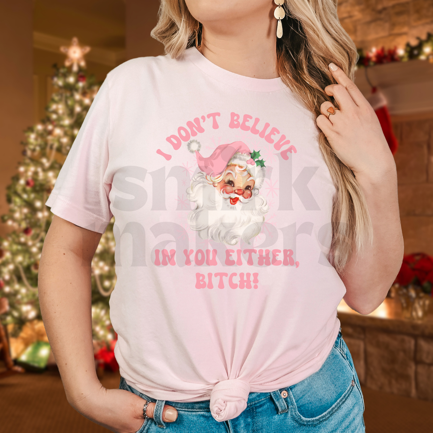 Santa's, I don't believe in you either, pink letters on pink tee.