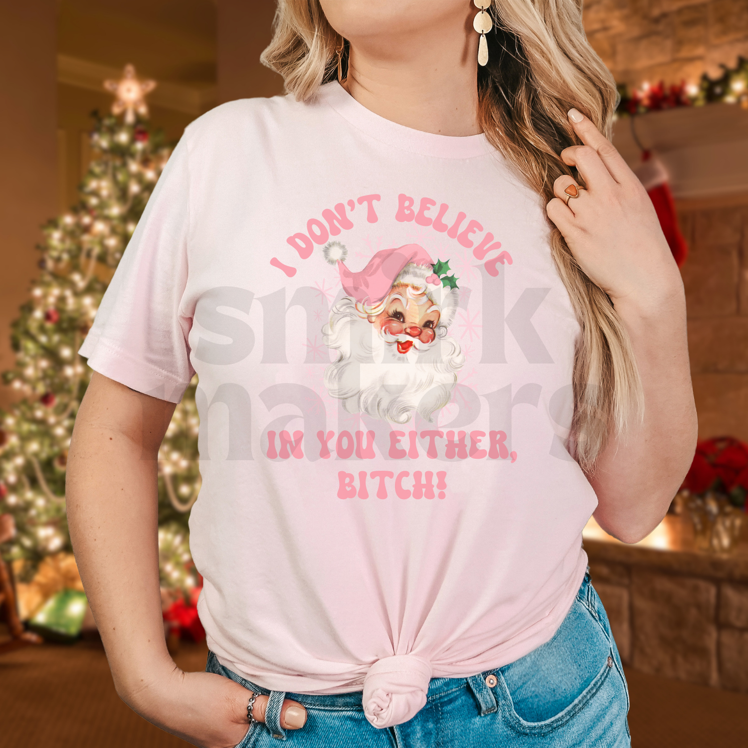 Santa's, I don't believe in you either, pink letters on pink tee.
