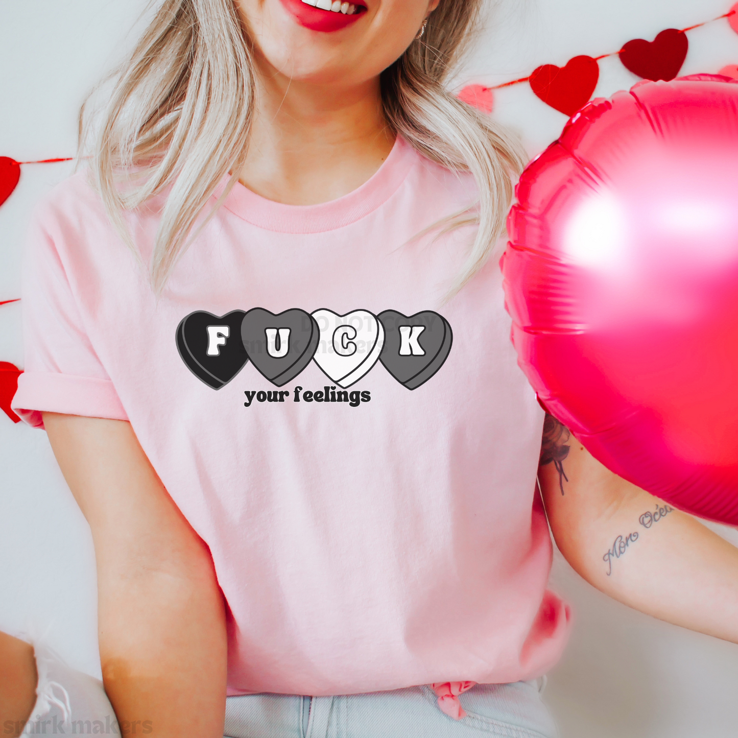 "Fuck your feelings" light pink Valentine's graphic tee.